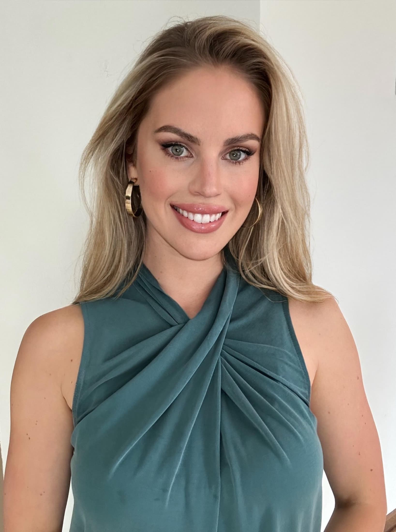 Sarah Baker wearing a teal top